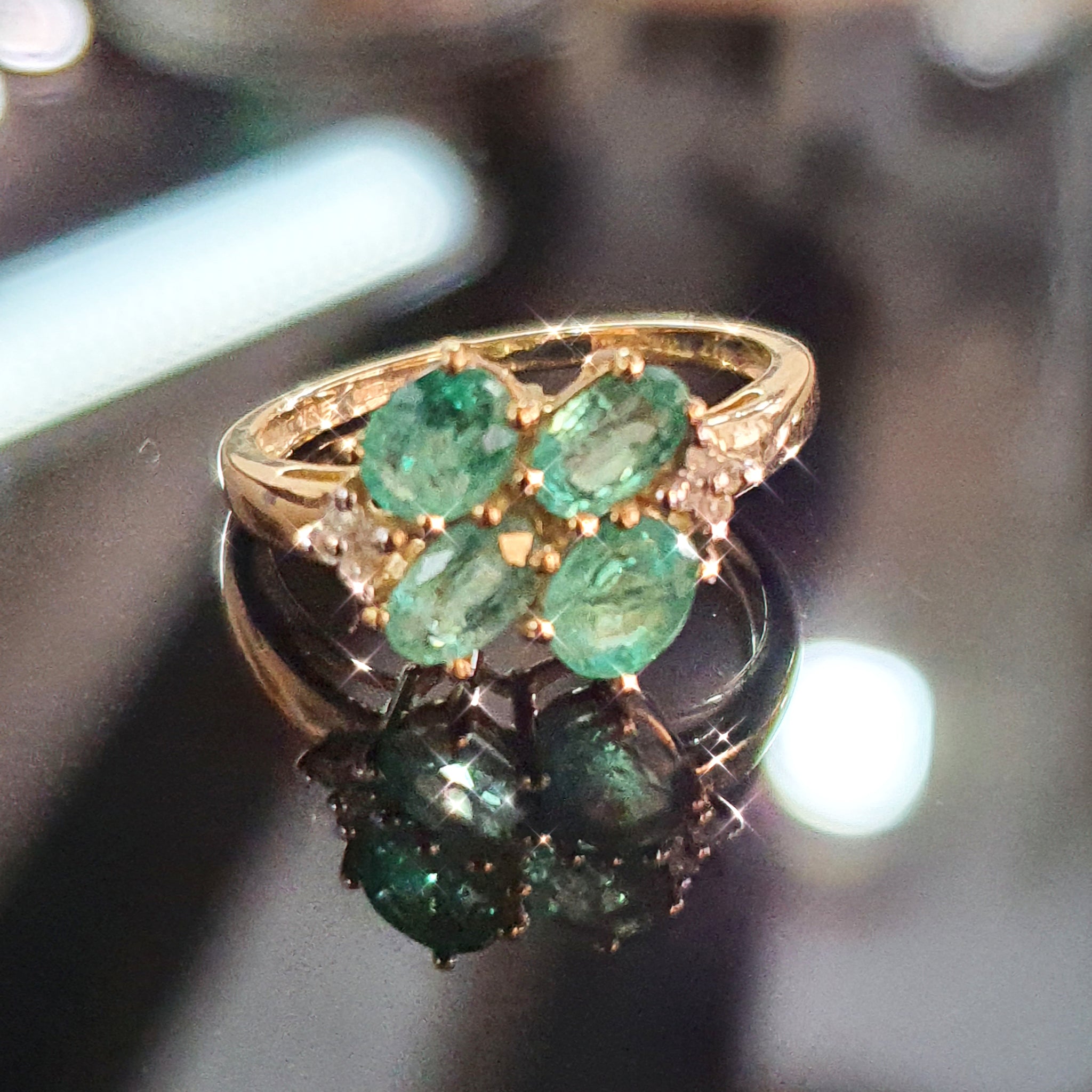 Emerald and Diamond ring set on 9ct Yellow Gold
